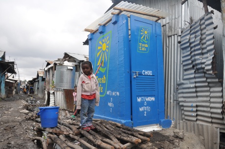 A young Fresh Life Toilet customer in Mukuru, Nairobi